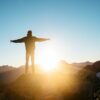 person standing on hill