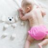 baby crawling on bed